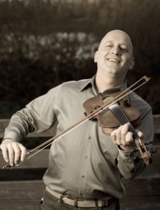 Evo Bluestein performs with fiddle and many other instruments.