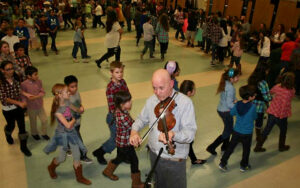 Evo fiddles and calls the Friday "Barn Dance."
